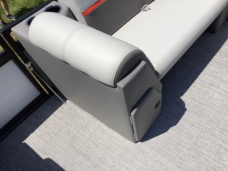 Slide: The Image of Qwest 820 Lanai L 2023 boat interior with gray seating and cup holders. - 12