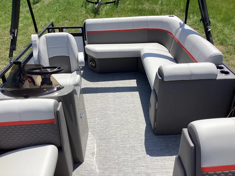 Slide: The Image of 2023 Qwest 820 Lanai L pontoon boat interior with gray and red seating. - 13