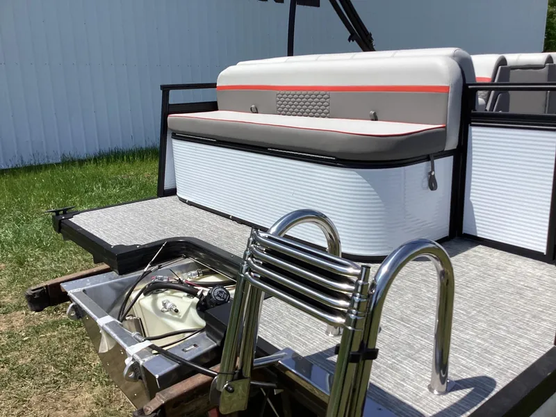 Slide: The Image of 2023 Qwest 820 Lanai L pontoon boat with rear seating and ladder. - 5