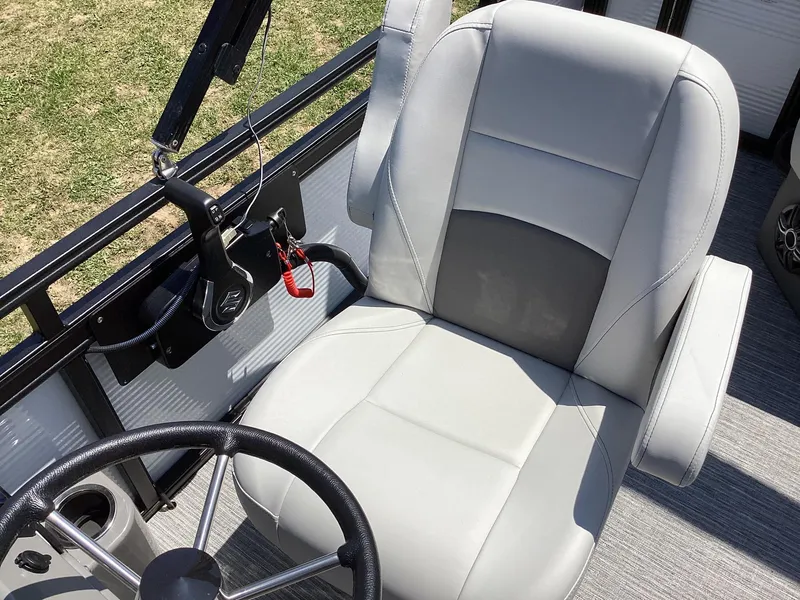 Slide: The Image of 2023 Qwest 820 Lanai L boat captain's chair and steering wheel. - 7