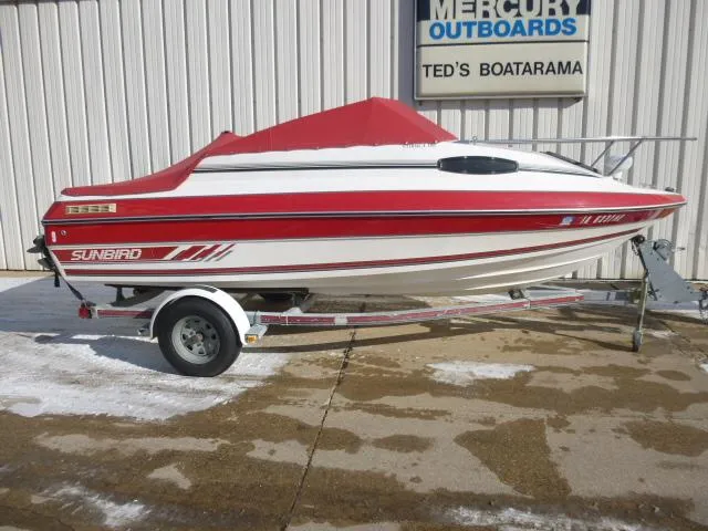 Slide: The Image of 1990 Sunbird CORSICA 188 Cuddy Cabin boat with red cover on trailer at Ted's Boatarama. - 1