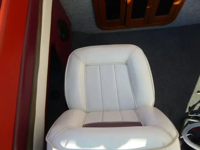 Slide: The Image of White cushioned seat in a 1990 Sunbird CORSICA 188 Cuddy Cabin boat. - 14