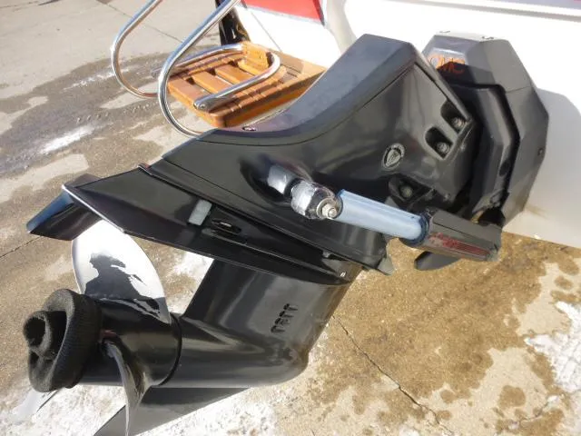Slide: The Image of Close-up of a 1990 Sunbird CORSICA 188 CUDDY CABIN boat's outboard motor. - 16