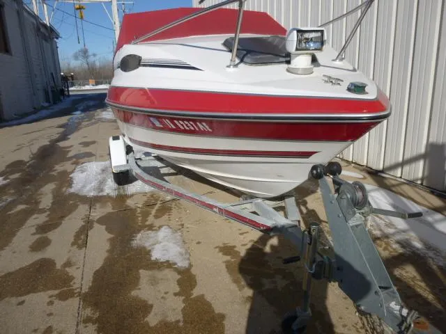 Slide: The Image of 1990 Sunbird CORSICA 188 Cuddy Cabin boat on trailer, red and white exterior. - 2