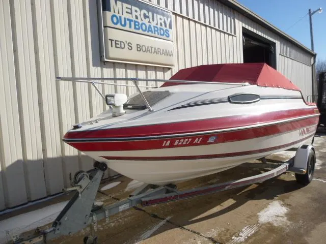 Slide: The Image of 1990 Sunbird CORSICA 188 Cuddy Cabin boat with red cover on trailer at Ted's Boatarama. - 8