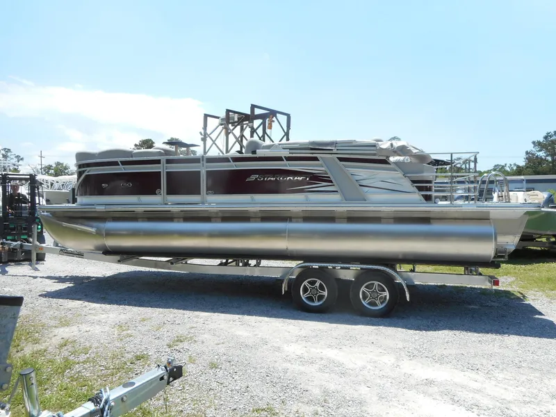 The Image of 2023 Starcraft CX 23 Q pontoon boat on a trailer. - 0