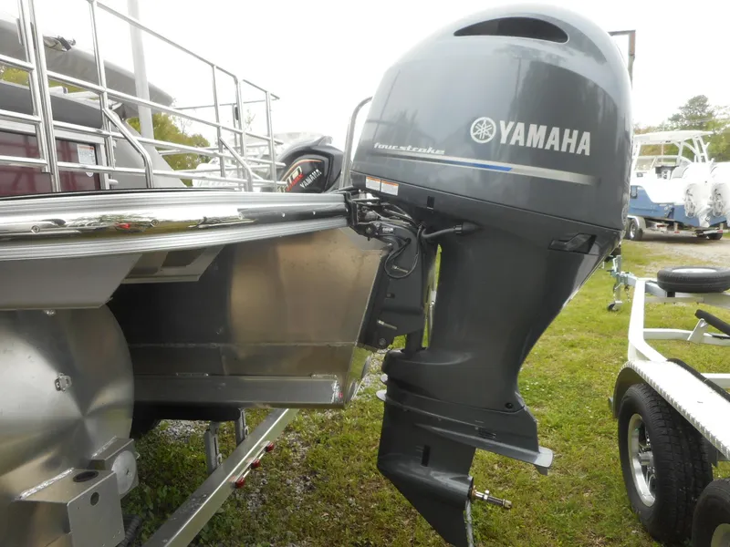 Slide: The Image of 2023 Starcraft CX 23 Q pontoon boat with Yamaha outboard motor. - 1