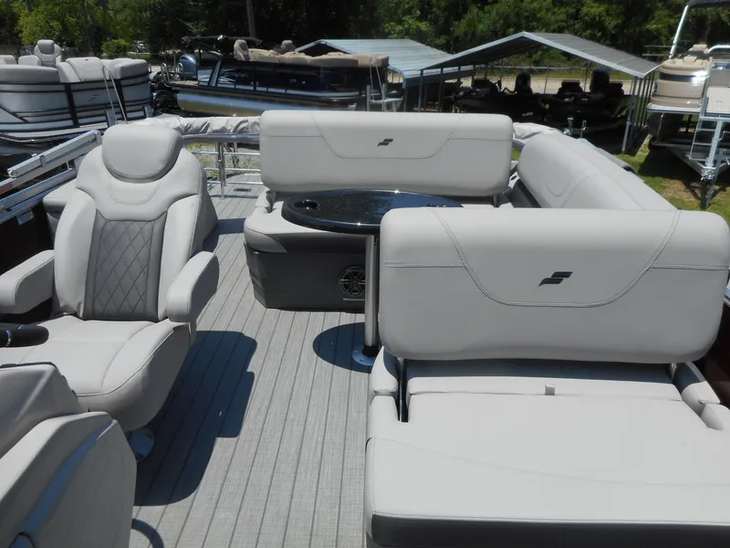 Slide: The Image of 2023 Starcraft CX 23 Q pontoon boat interior with luxurious seating. - 11