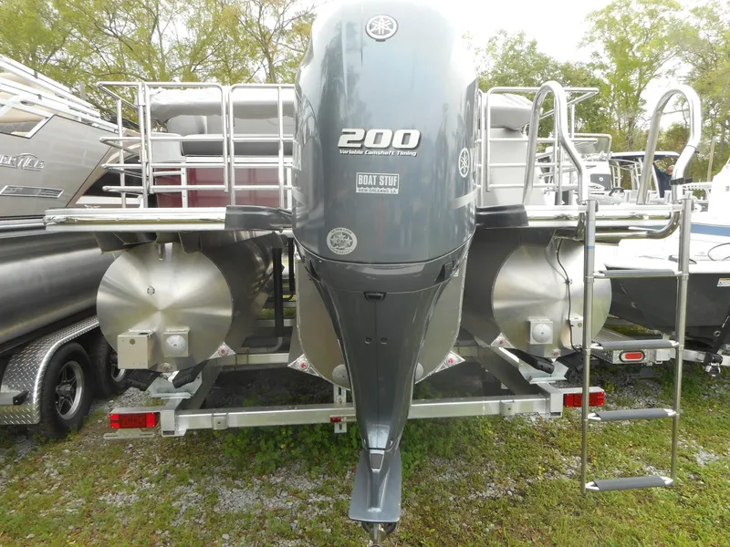 Slide: The Image of 2023 Starcraft CX 23 Q pontoon boat with Yamaha 200 engine, rear view. - 2