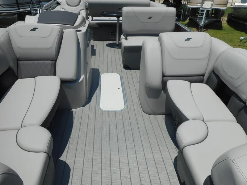 Slide: The Image of 2023 Starcraft CX 23 Q pontoon boat interior with luxurious seating. - 4