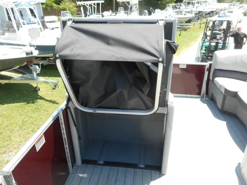 Slide: The Image of 2023 Starcraft CX 23 Q boat with a foldable privacy enclosure. - 5