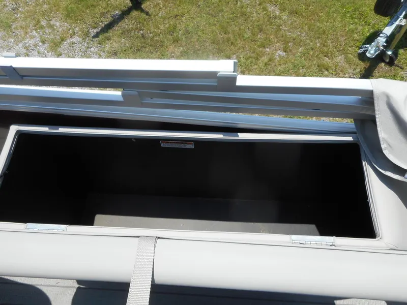 Slide: The Image of Open storage compartment on a 2023 Starcraft CX 23 Q boat. - 7