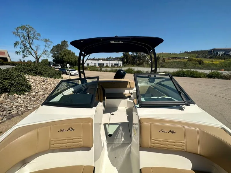 Slide: The Image of 2023 Sea Ray SPX 190 Outboard boat with tan seating and open cockpit. - 10