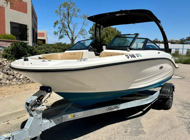 Slide: The Image of 2023 Sea Ray SPX 190 Outboard boat on trailer, parked outdoors. - 7