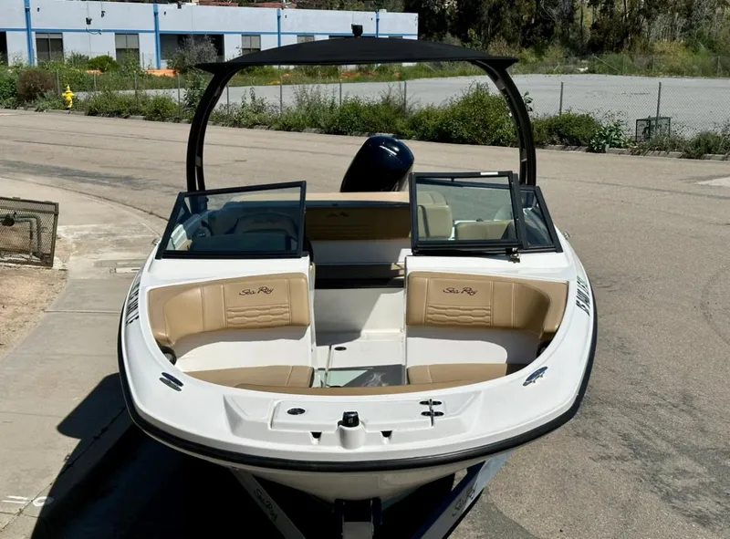 Slide: The Image of 2023 Sea Ray SPX 190 Outboard boat with open bow seating, parked outdoors. - 8