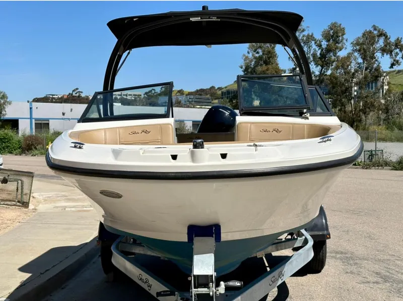 Slide: The Image of 2023 Sea Ray SPX 190 Outboard boat on trailer, front view, outdoors. - 9