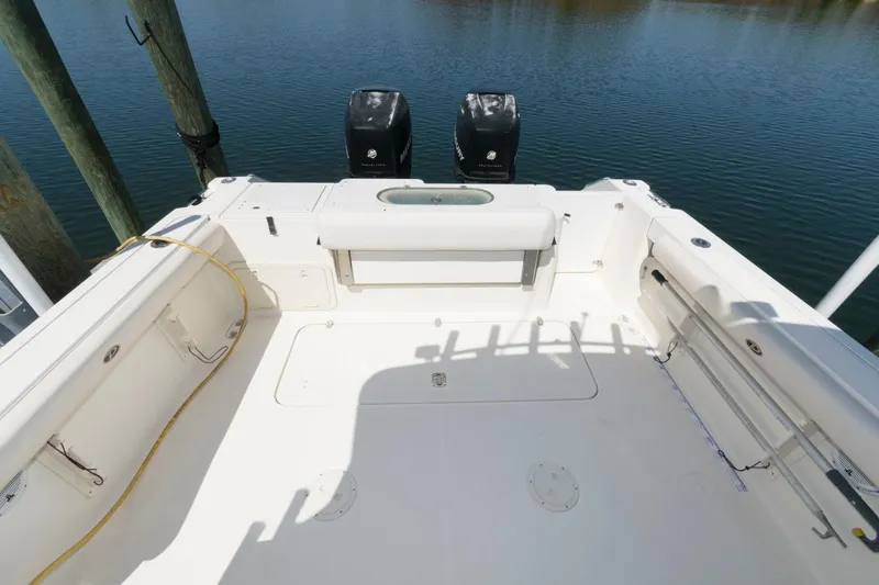 Slide: The Image of 2006 Pursuit 3070 Offshore boat deck with twin outboard motors. - 4