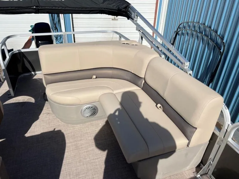 Slide: The Image of 2023 Sun Tracker PARTY BARGE® 18 DLX pontoon boat with beige seating. - 5
