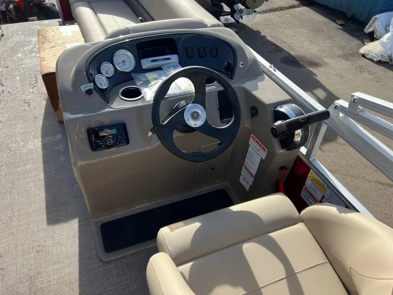 Slide: The Image of 2023 Sun Tracker PARTY BARGE® 18 DLX boat console and steering wheel. - 6