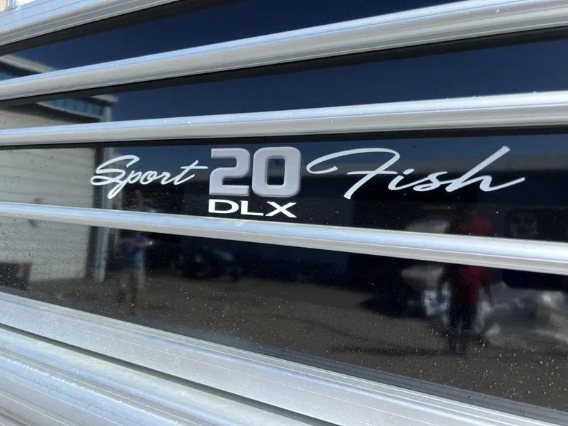 Slide: The Image of 2023 Sun Tracker Sportfish™ 20 DLX logo on boat exterior. - 5