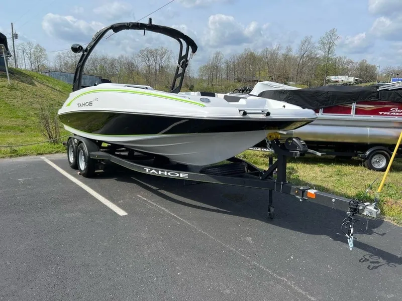 Slide: The Image of 2023 Tahoe 2150 boat on trailer in parking lot. - 4