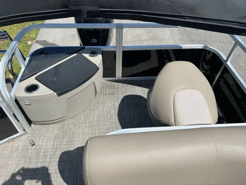 Slide: The Image of 2023 Ranger 200F boat interior with seating and storage compartments. - 2