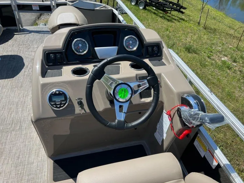 Slide: The Image of 2023 Ranger 200F boat dashboard with steering wheel and control panel. - 8
