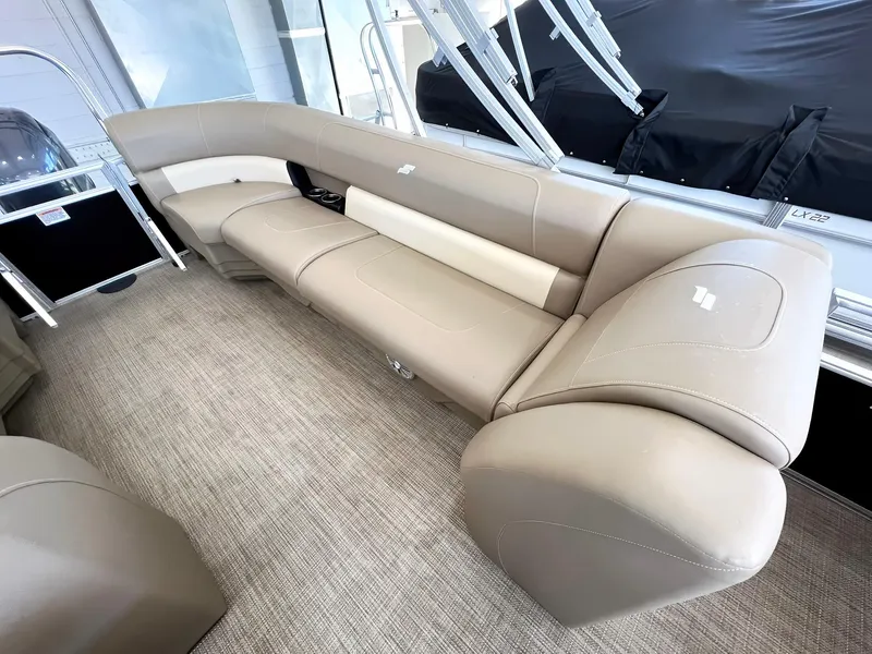 Slide: The Image of 2023 Starcraft LX 22 R boat interior with beige seating and modern design. - 17