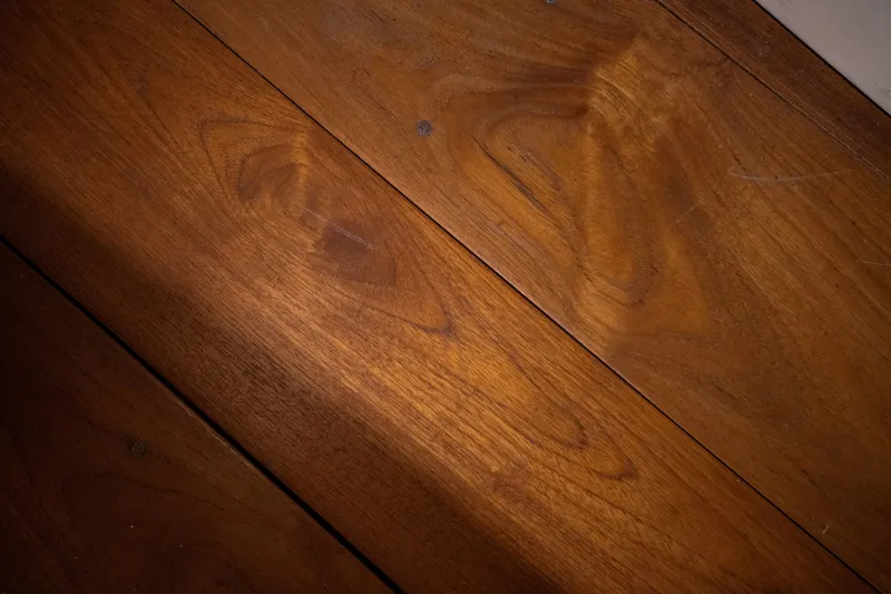 Slide: The Image of Polished wooden surface of a 2008 Custom Frank Paine Sloop, showcasing rich grain patterns. - 30