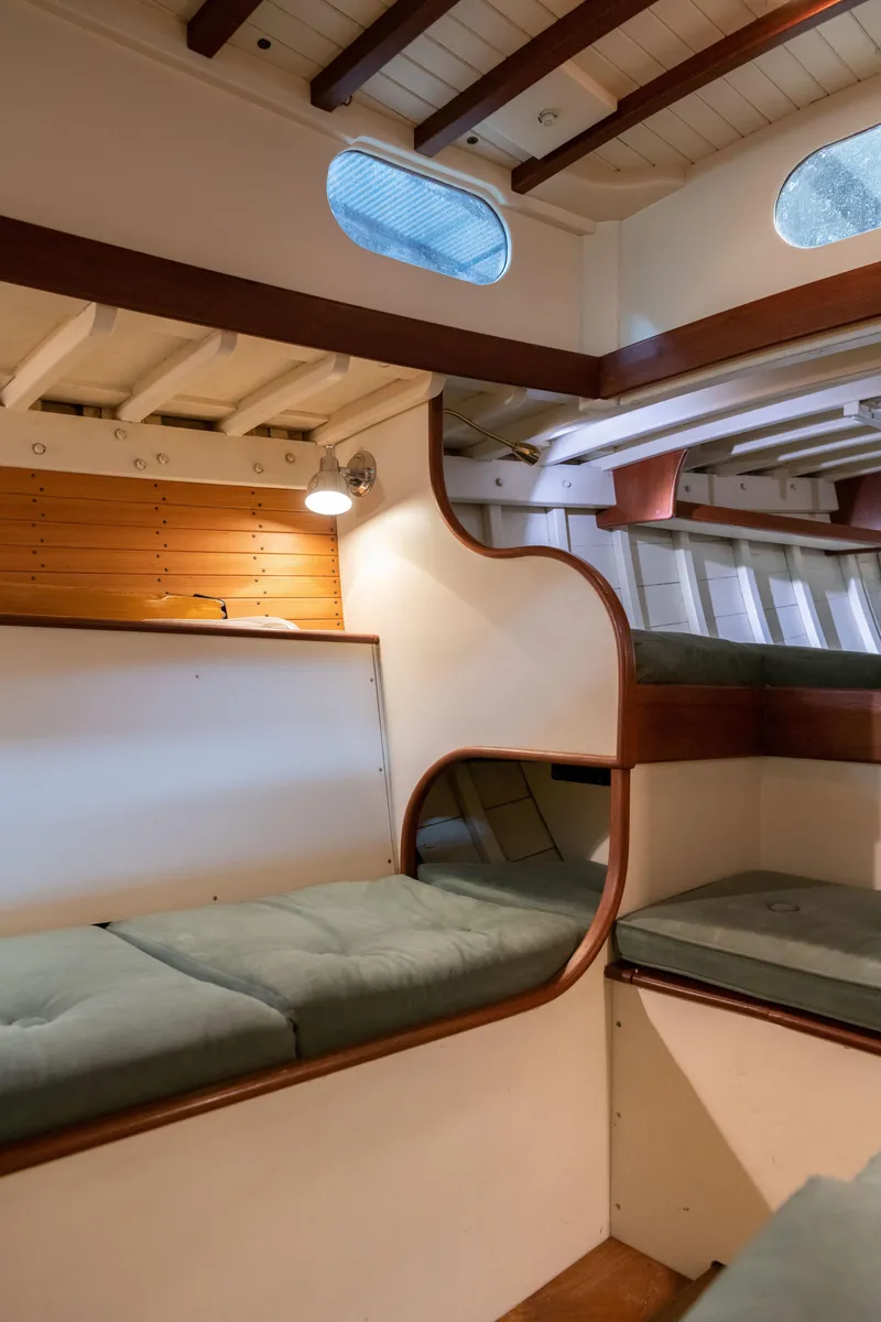 Slide: The Image of Interior of 2008 Custom Frank Paine Sloop with wooden accents and cushioned seating. - 33