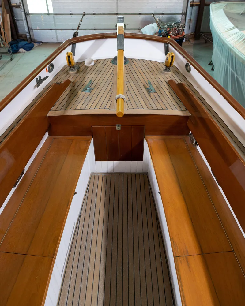 Slide: The Image of Interior view of 2008 Custom Frank Paine Sloop with wooden benches and deck. - 39