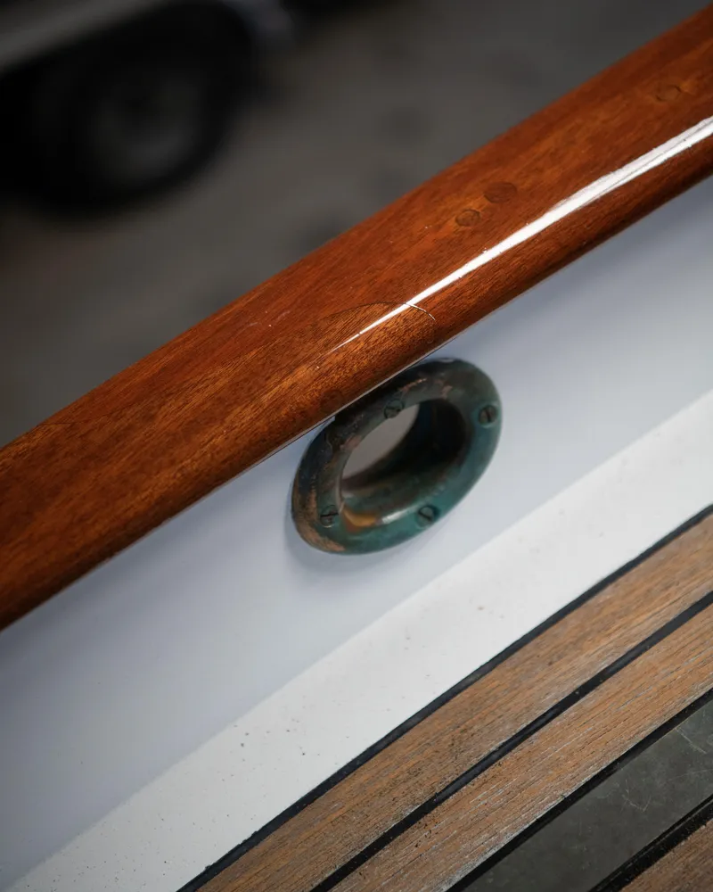 Slide: The Image of Polished wood railing on 2008 Custom Frank Paine Sloop with metal fitting. - 48