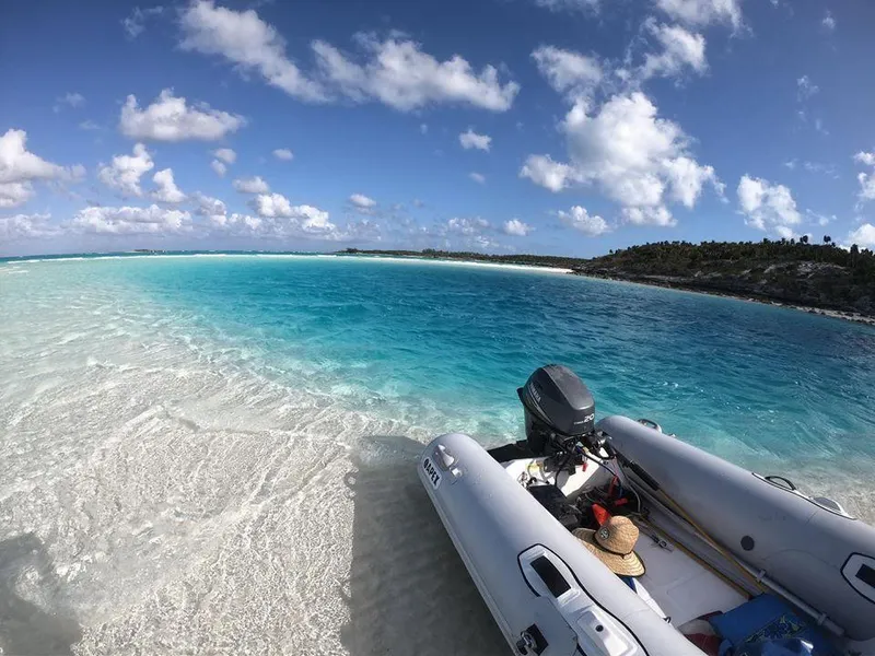 The Image of Apex A10 RIB 2022 on a pristine beach with turquoise waters and clear skies. - 1
