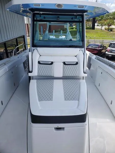 Slide: The Image of 2023 Blackfin 332cc center console boat with white and gray seating. - 10