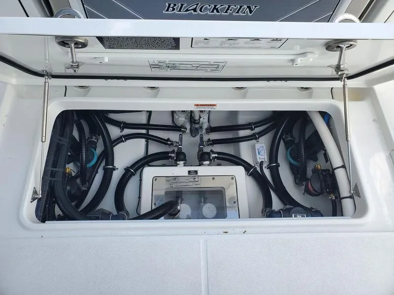 Slide: The Image of 2023 Blackfin 332cc boat engine compartment with wiring and components. - 12