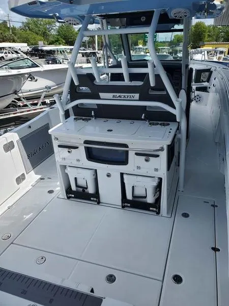Slide: The Image of 2023 Blackfin 332cc boat interior with fishing station and storage compartments. - 3