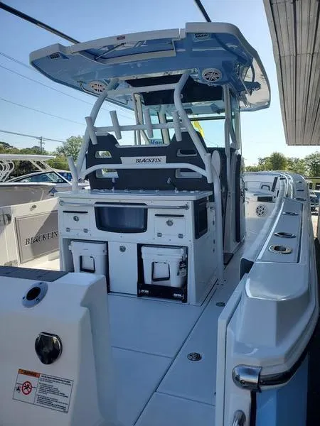 Slide: The Image of 2023 Blackfin 332cc center console boat with advanced fishing amenities. - 4