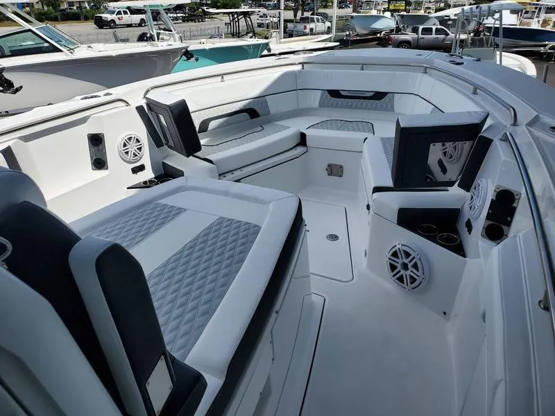 Slide: The Image of 2023 Blackfin 332cc boat interior with luxurious seating and modern amenities. - 8