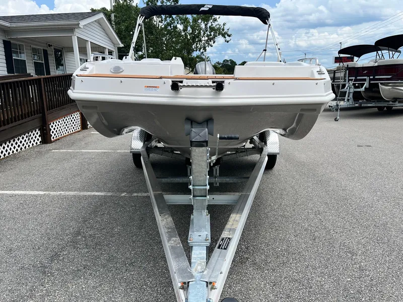 Slide: The Image of 2024 Starcraft SVX 171 boat on a trailer in a parking lot. - 3