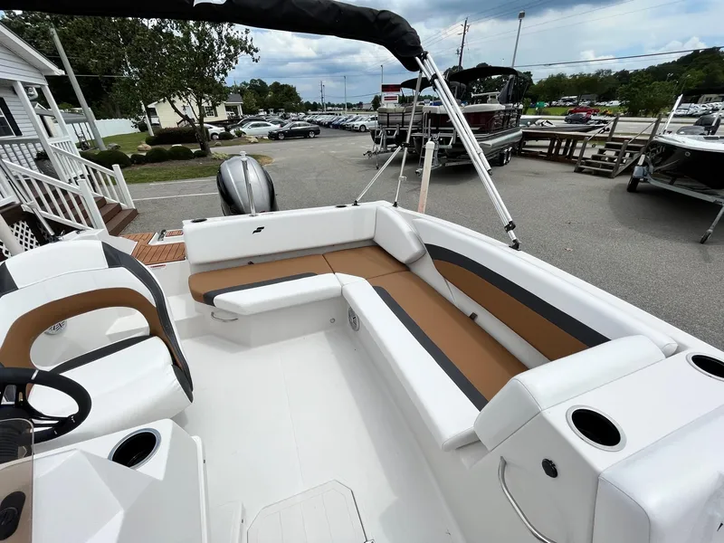 Slide: The Image of 2024 Starcraft SVX 171 boat interior with white and tan seating. - 4