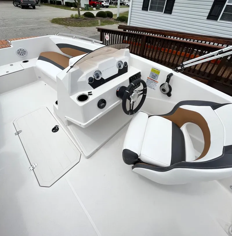Slide: The Image of 2024 Starcraft SVX 171 boat interior with modern dashboard and seating. - 7