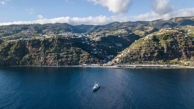 Slide: The Image of Damen YS 4508 yacht near coastal landscape, 2019. - 4