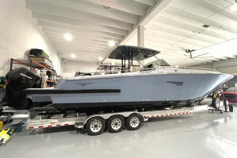 Slide: The Image of 2023 Canados 431 GLADIATOR boat on a trailer in a storage facility. - 11