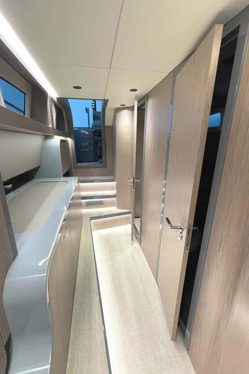 Slide: The Image of Modern interior of 2023 Canados 431 Gladiator yacht with sleek wood finishes. - 34