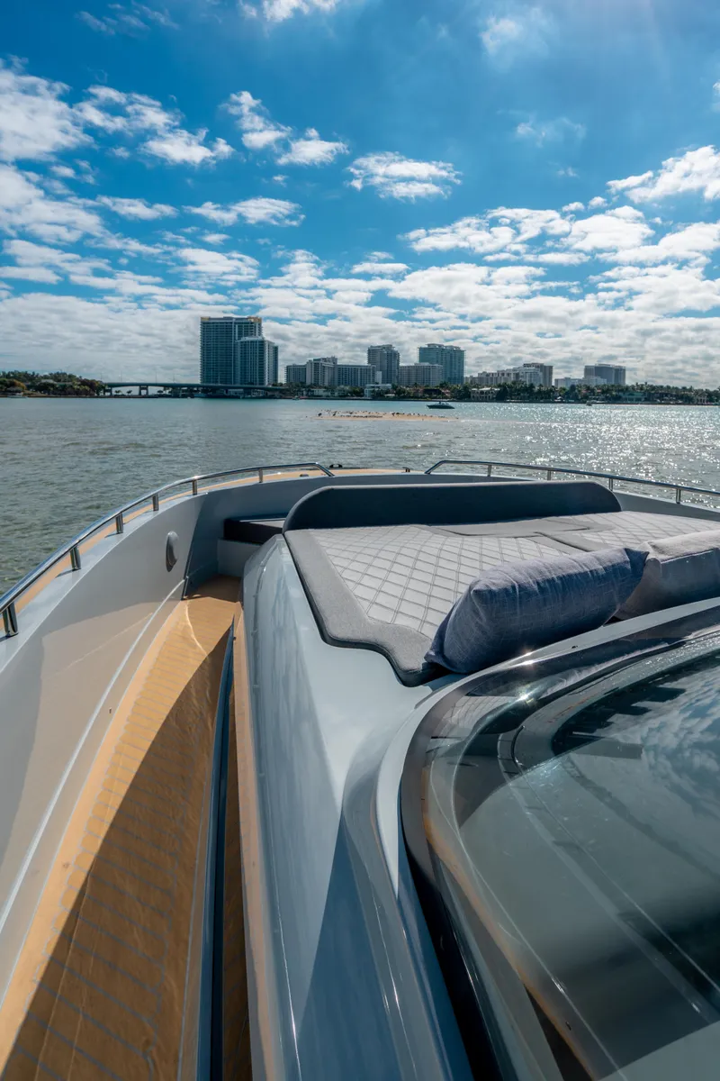 Slide: The Image of 2023 Canados 431 GLADIATOR yacht with city skyline in the background. - 7