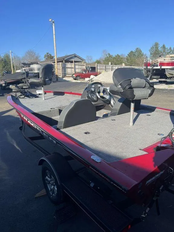 Slide: The Image of 2023 Tracker Pro Team™ 190 TX fishing boat, red exterior, parked outdoors. - 3