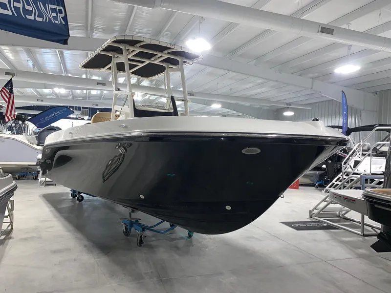 Slide: The Image of 2024 Bayliner Trophy 22CC boat in showroom. - 1