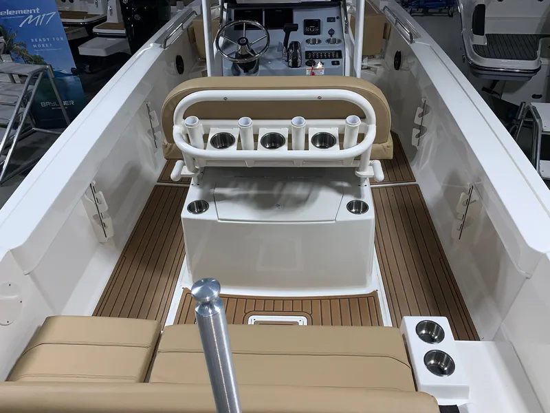 Slide: The Image of 2024 Bayliner Trophy 22CC boat interior with seating and rod holders. - 3