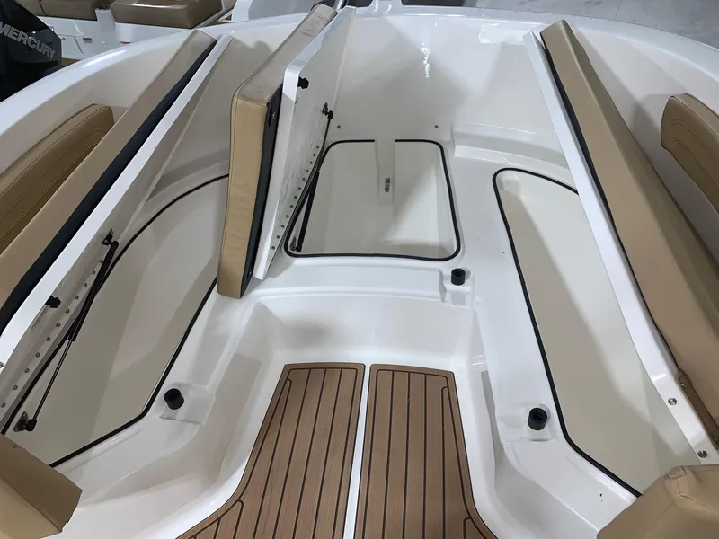 Slide: The Image of 2024 Bayliner Trophy 22CC boat interior with seating and storage compartments. - 8