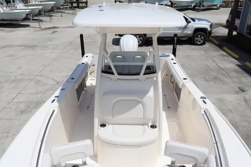 Slide: The Image of 2023 Sea Born SX239 Offshore boat interior with seating and console. - 10